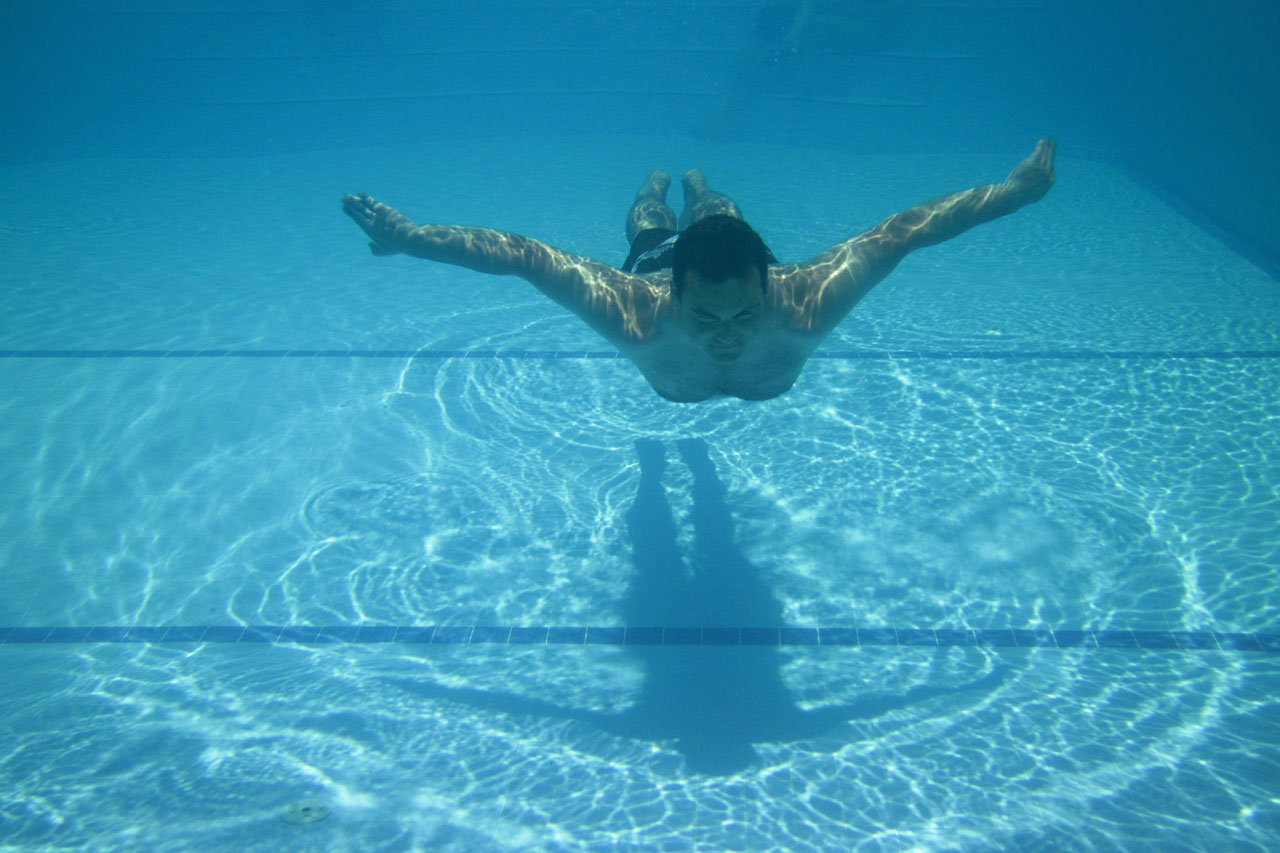 man-swimming-in-pool